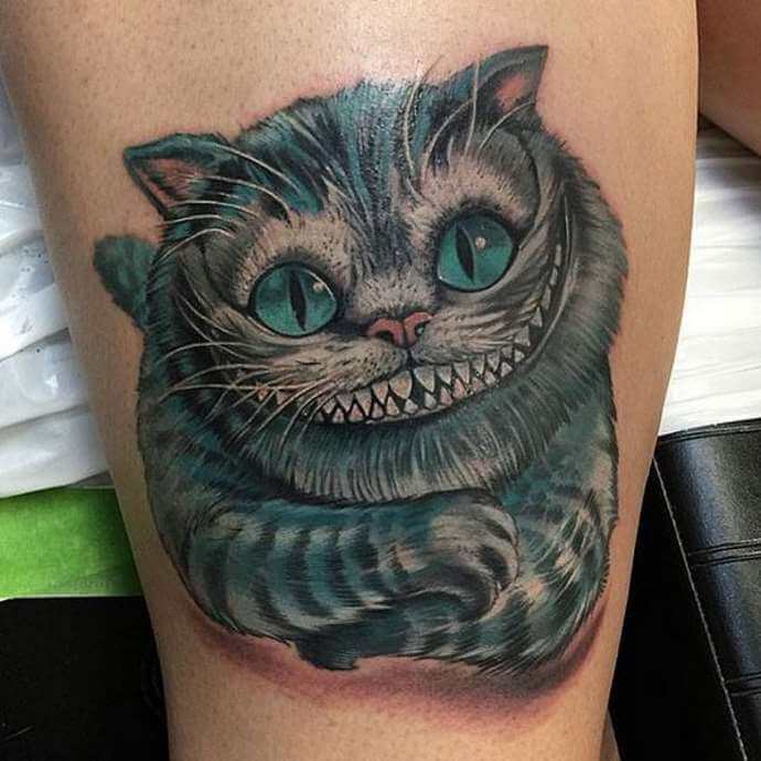 cheshire cat tatuointi merkitys