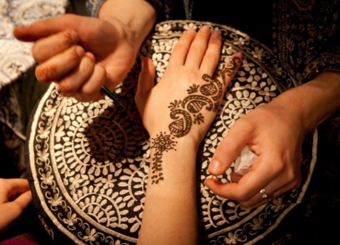 Applying mehendi is a painstaking and long procedure.