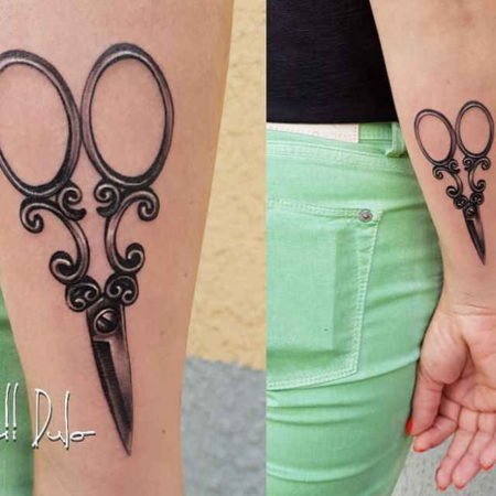 Tatuaggio di forbici sull'avambraccio