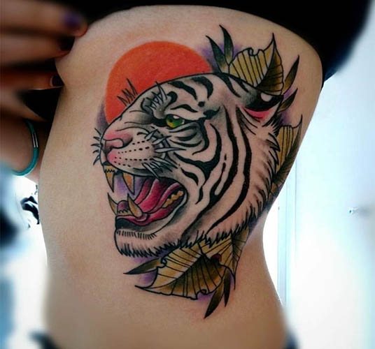 Occhiale tigrato. Foto, significato, su spalla, sterno, braccio, gamba