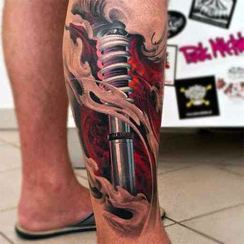 Biomechanikos tatuiruotė ant kojos - nuotrauka