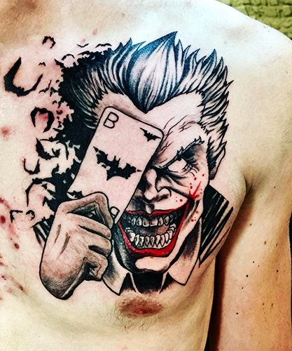 Joker-tatuointi käsivarteen, kyynärvarteen ja jalkaan. Luonnokset, valokuva, merkitys