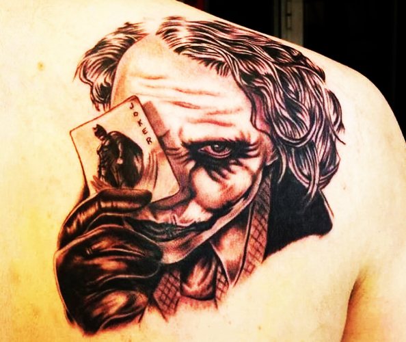 Tattoo Joker op de arm, onderarm, been. Schetsen, foto, betekenis