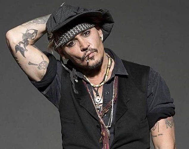 Johnny Depp tattoo. Pictures on the arm, back, hand