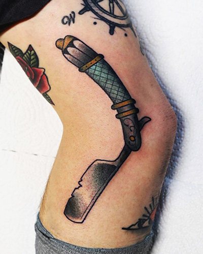 Tatuointi bowie-veitsi. Kuva, merkitys, pikkukuvat, joissa on ruusu, kirjoitus, hämähäkinverkko