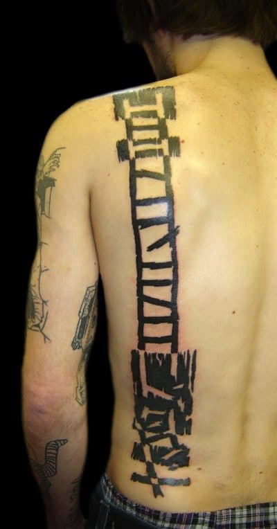 Tattoo of a stalker on his back