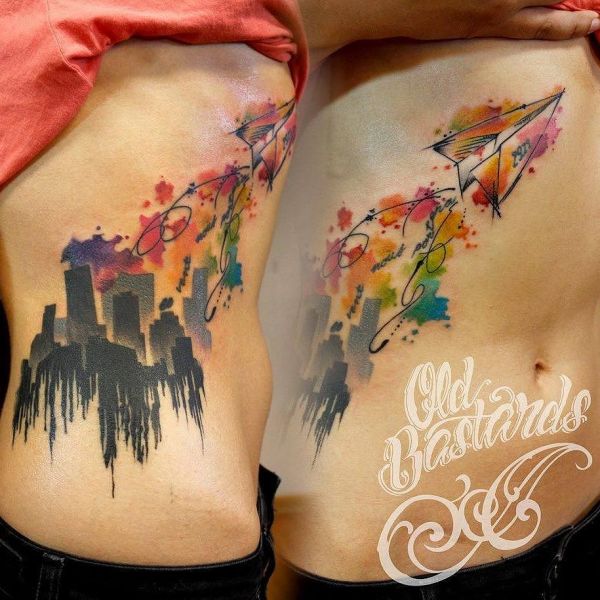 Tattoo watercolor city with airplane