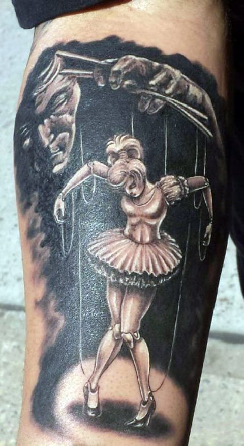 Lėlininko ir lėlių meistro tatuiruotė