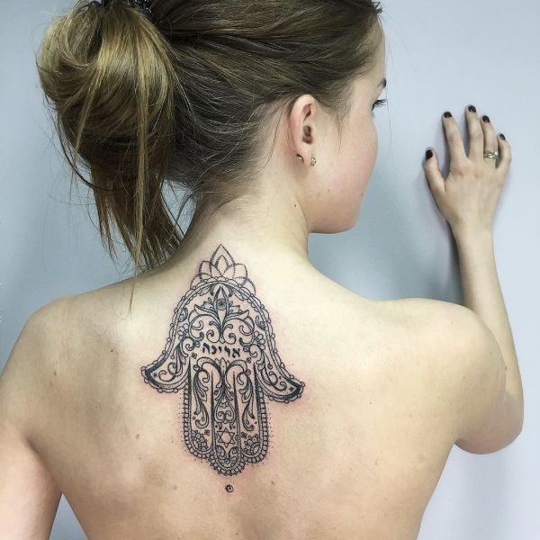 Tattoo of upside down hams on back