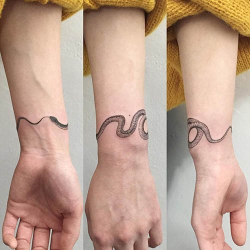Ouroboros-tatuointi. Luonnos, eli käsivarren, jalan, ranteen, selän, kaulan ympärillä.
