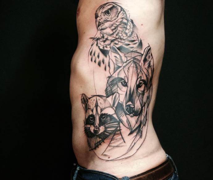 tatuagem de lobo, guaxinim e coruja