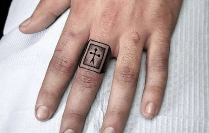 Tyve tatoveringer på fingrene. Betydning, foto